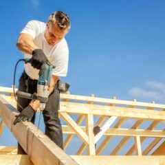 a man using a drill to drill a roof