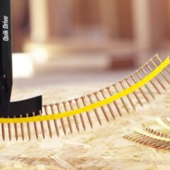 a yellow and black device with many nails